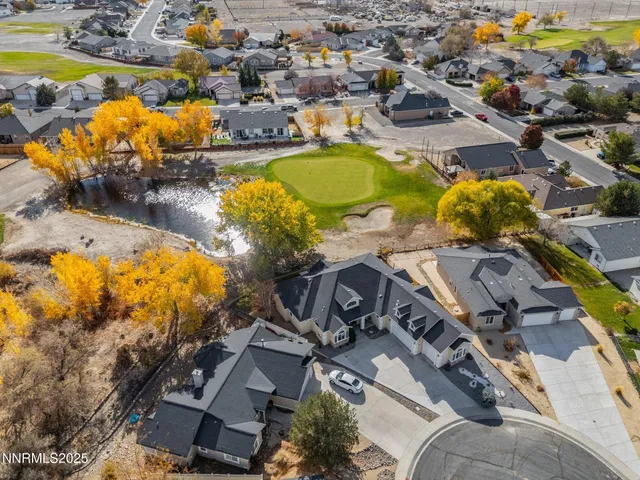 an aerial view of residential houses with swimming pool