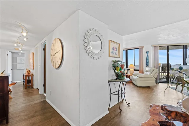 a living room with furniture and a clock