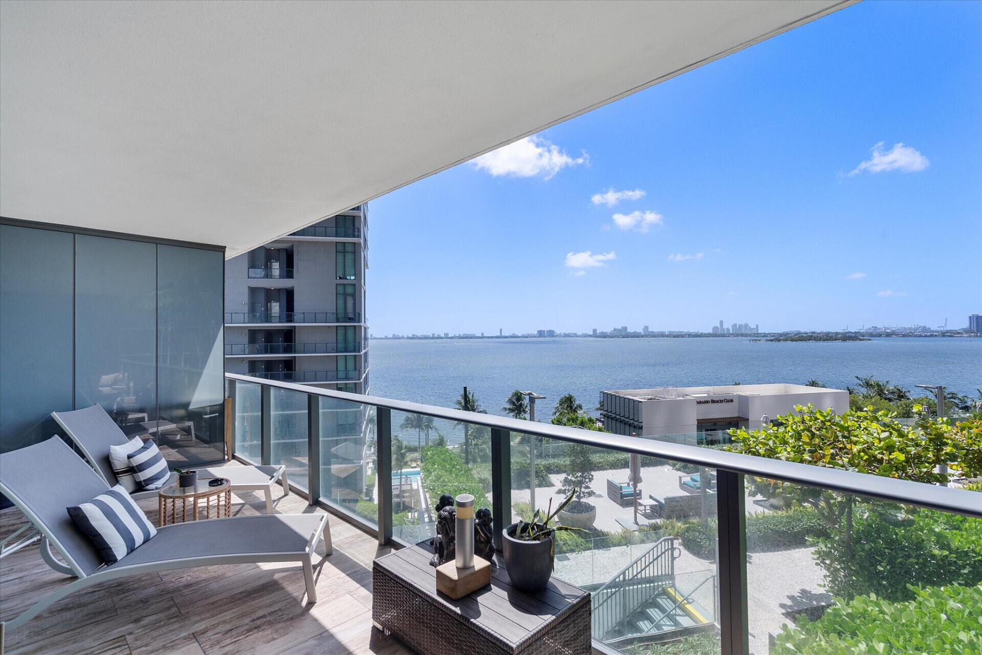 a view of a balcony with chair and glass door