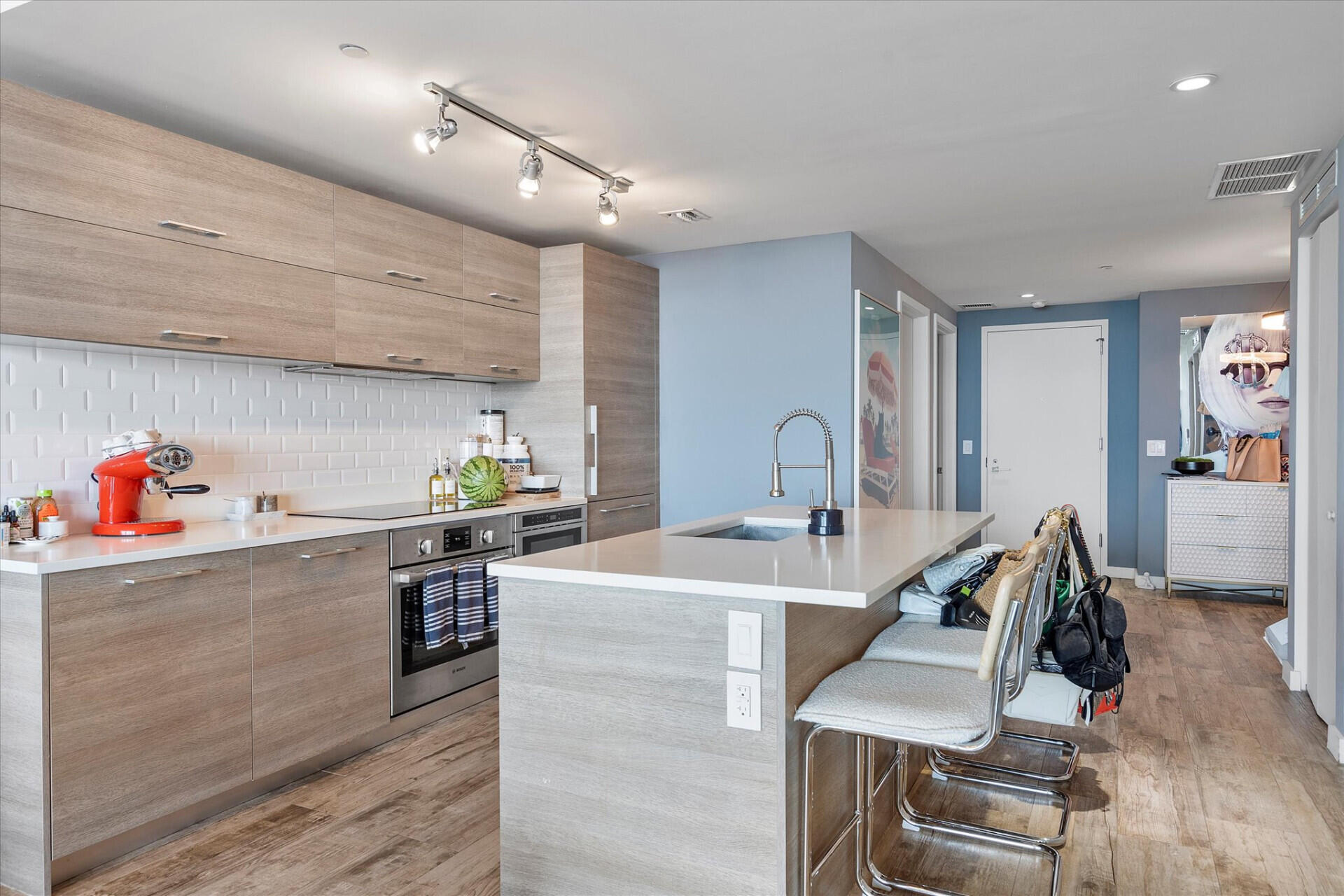 650 Northeast 32nd Street, Unit 606 Miami, FL 33137 - Photo 11 of 24 a kitchen with granite countertop a sink stove and cabinets