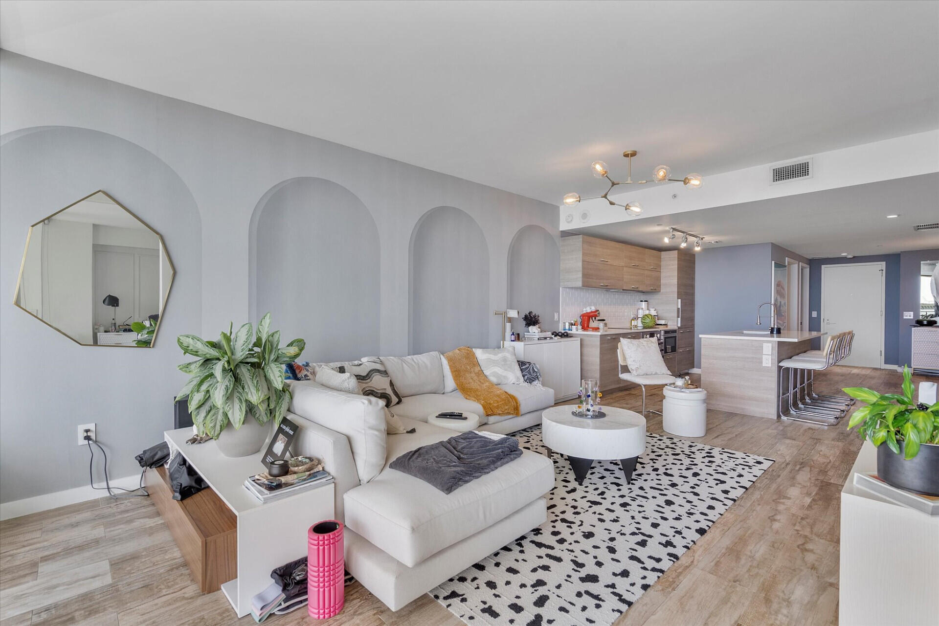 650 Northeast 32nd Street, Unit 606 Miami, FL 33137 - Photo 13 of 24 a living room with furniture a chandelier and a rug