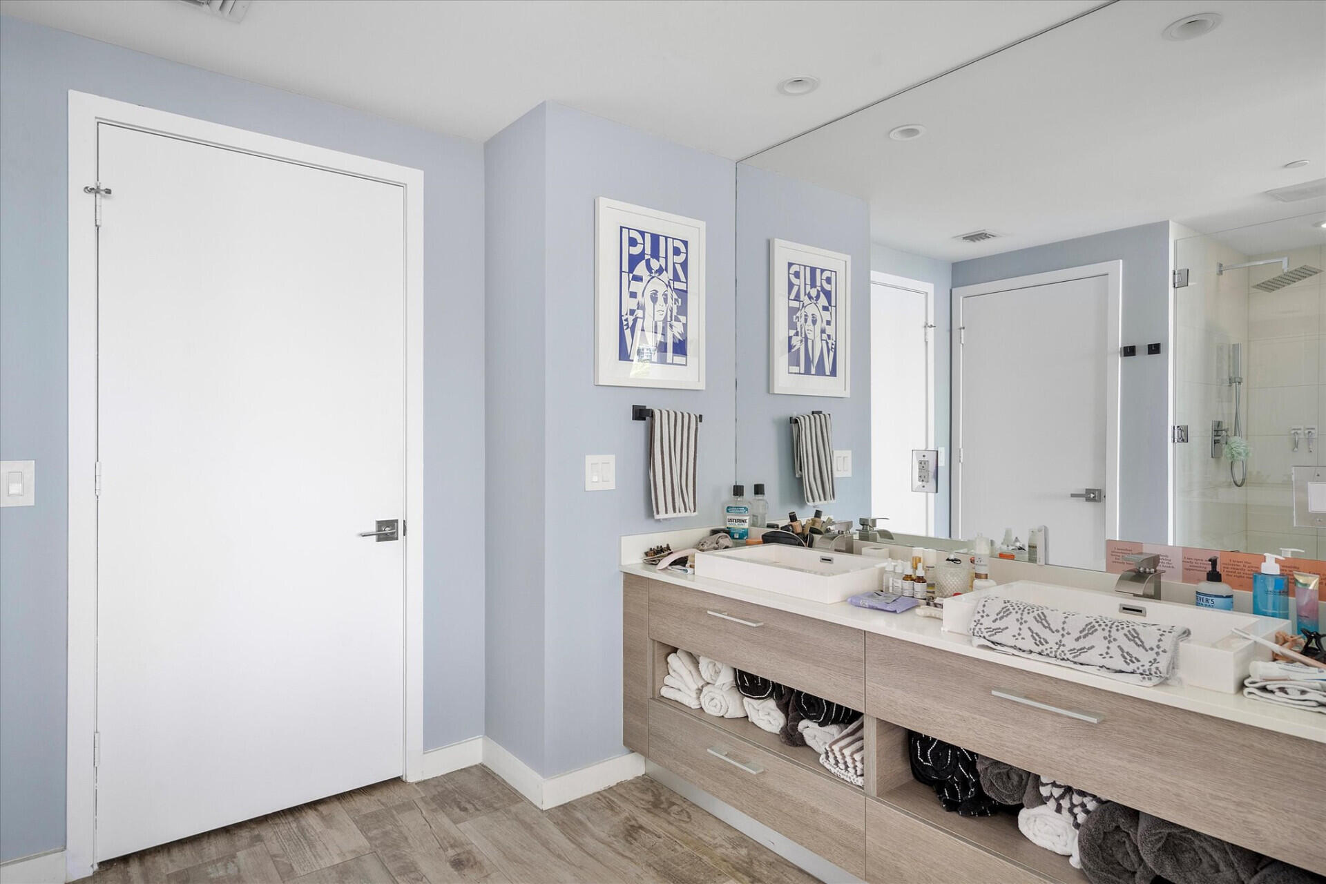 650 Northeast 32nd Street, Unit 606 Miami, FL 33137 - Photo 24 of 24 a bathroom with a sink a mirror and a shower