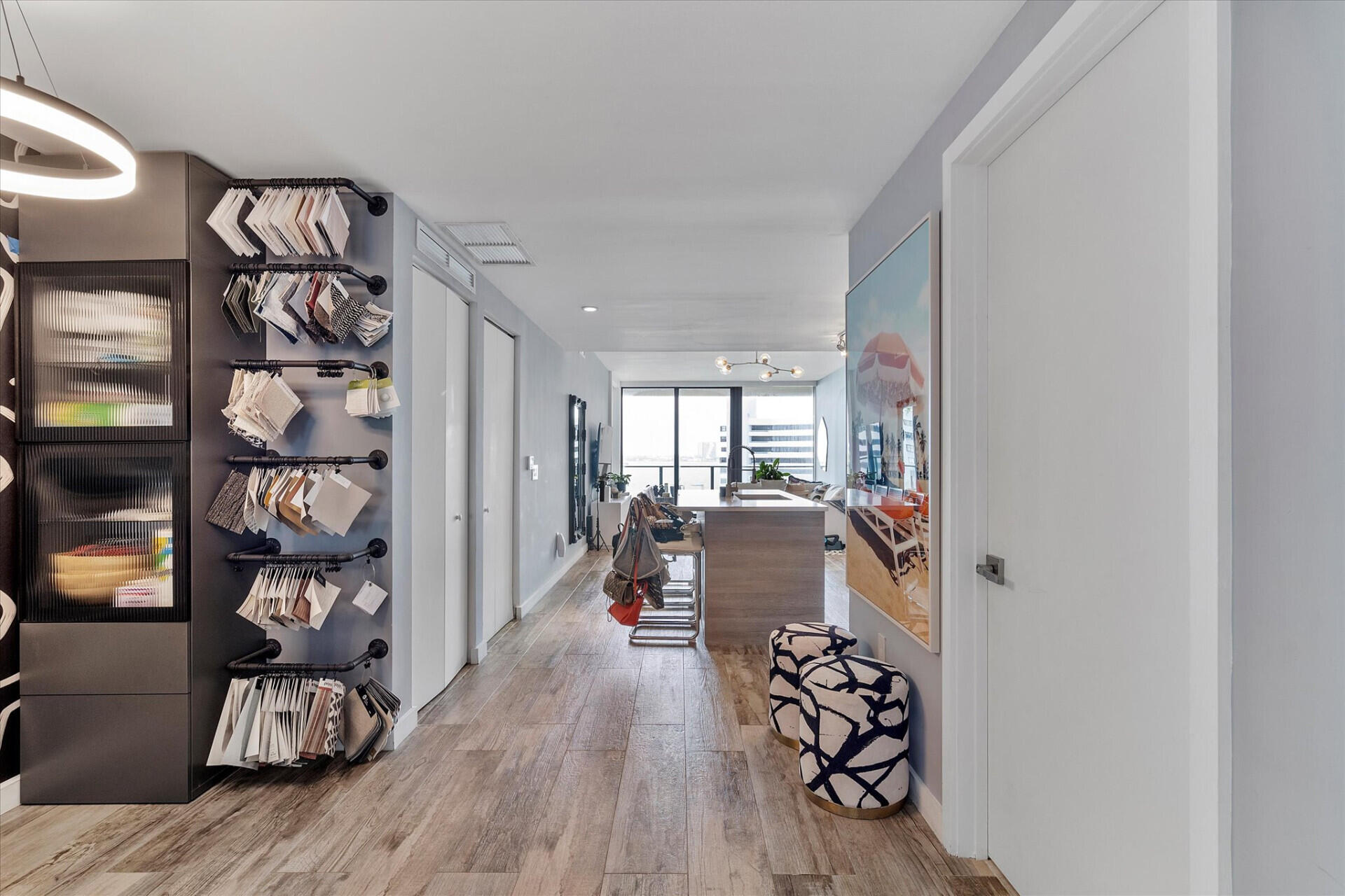 650 Northeast 32nd Street, Unit 606 Miami, FL 33137 - Photo 4 of 24 a room with lots of white furniture and wooden floor