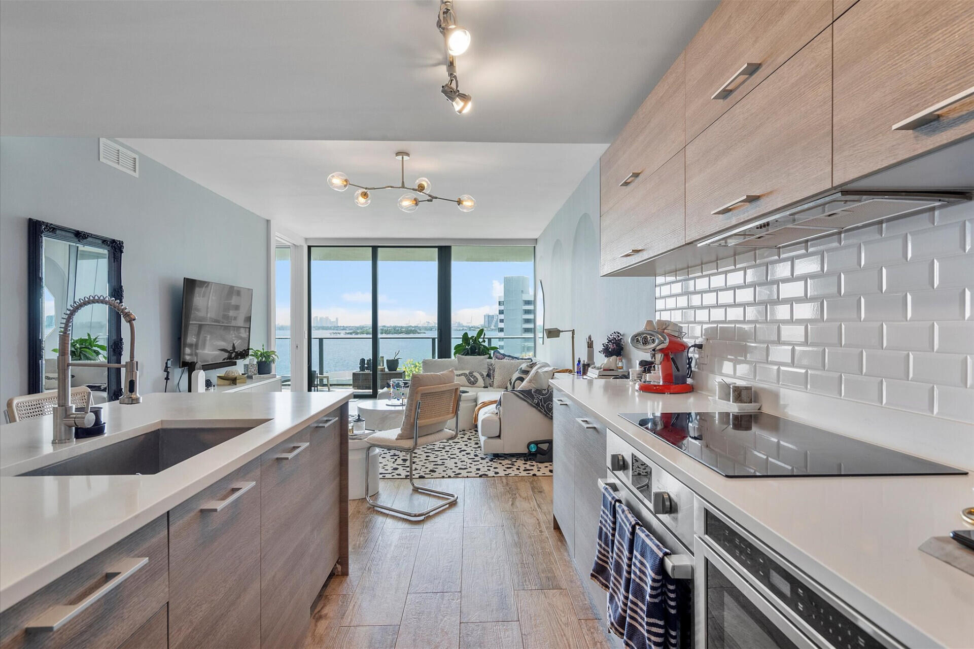 650 Northeast 32nd Street, Unit 606 Miami, FL 33137 - Photo 10 of 24 a kitchen with sink stove and cabinets