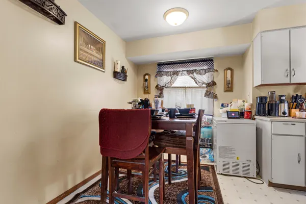 a dining room with furniture and window