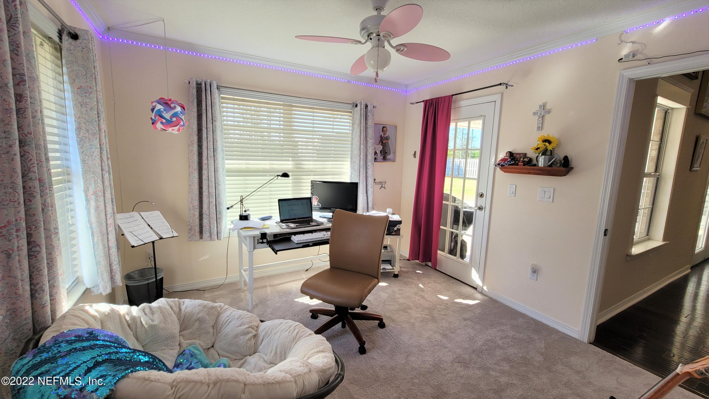 2867 Longleaf Ranch Circle Middleburg, FL 32068 - Photo 20 of 33 a view of a livingroom with workspace and a window