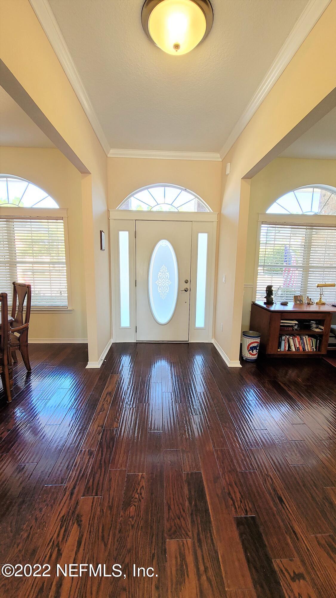 2867 Longleaf Ranch Circle Middleburg, FL 32068 - Photo 2 of 33 a view of a room with wooden floor and a window