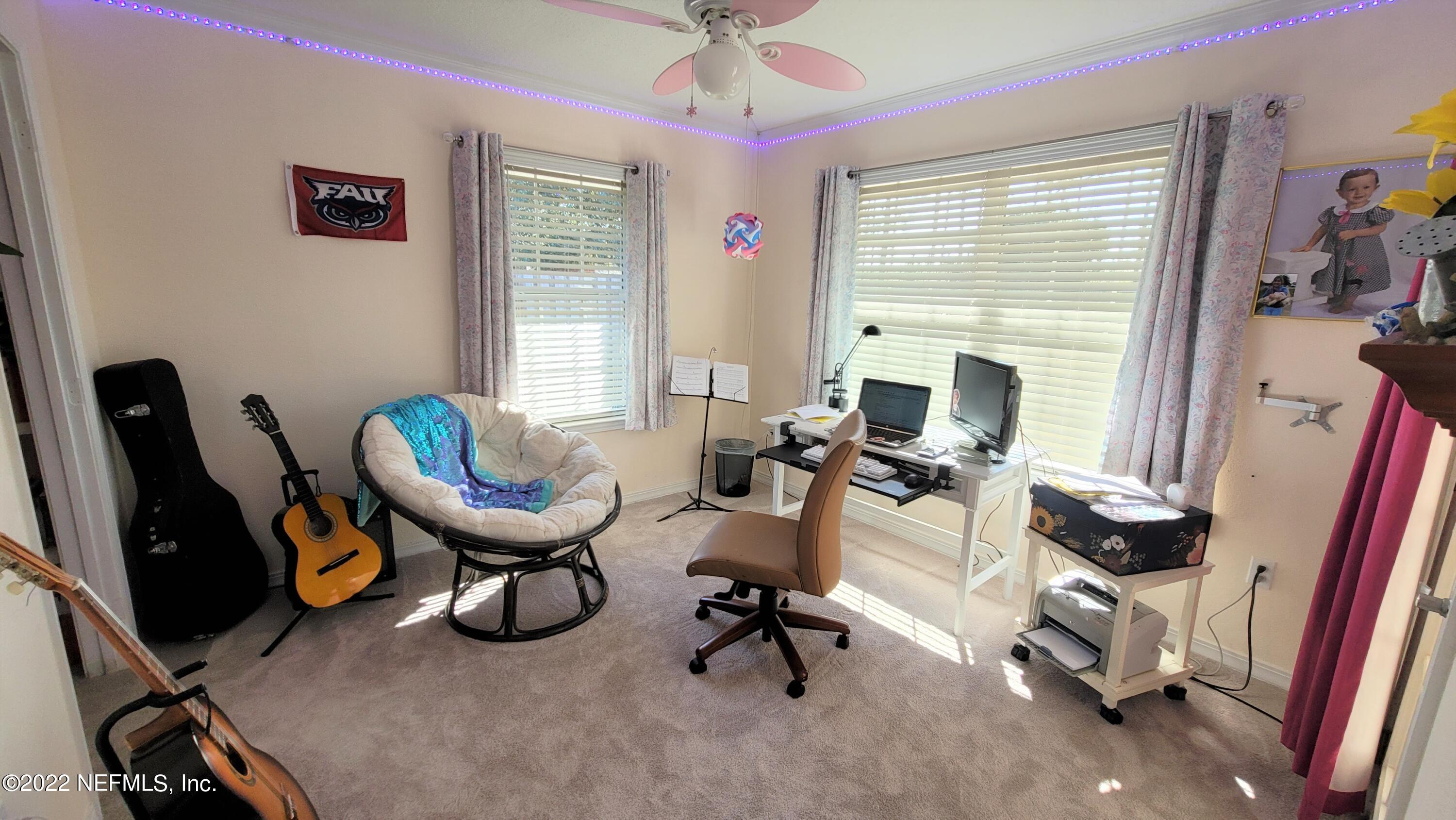 2867 Longleaf Ranch Circle Middleburg, FL 32068 - Photo 21 of 33 a view of a livingroom with workspace and a window
