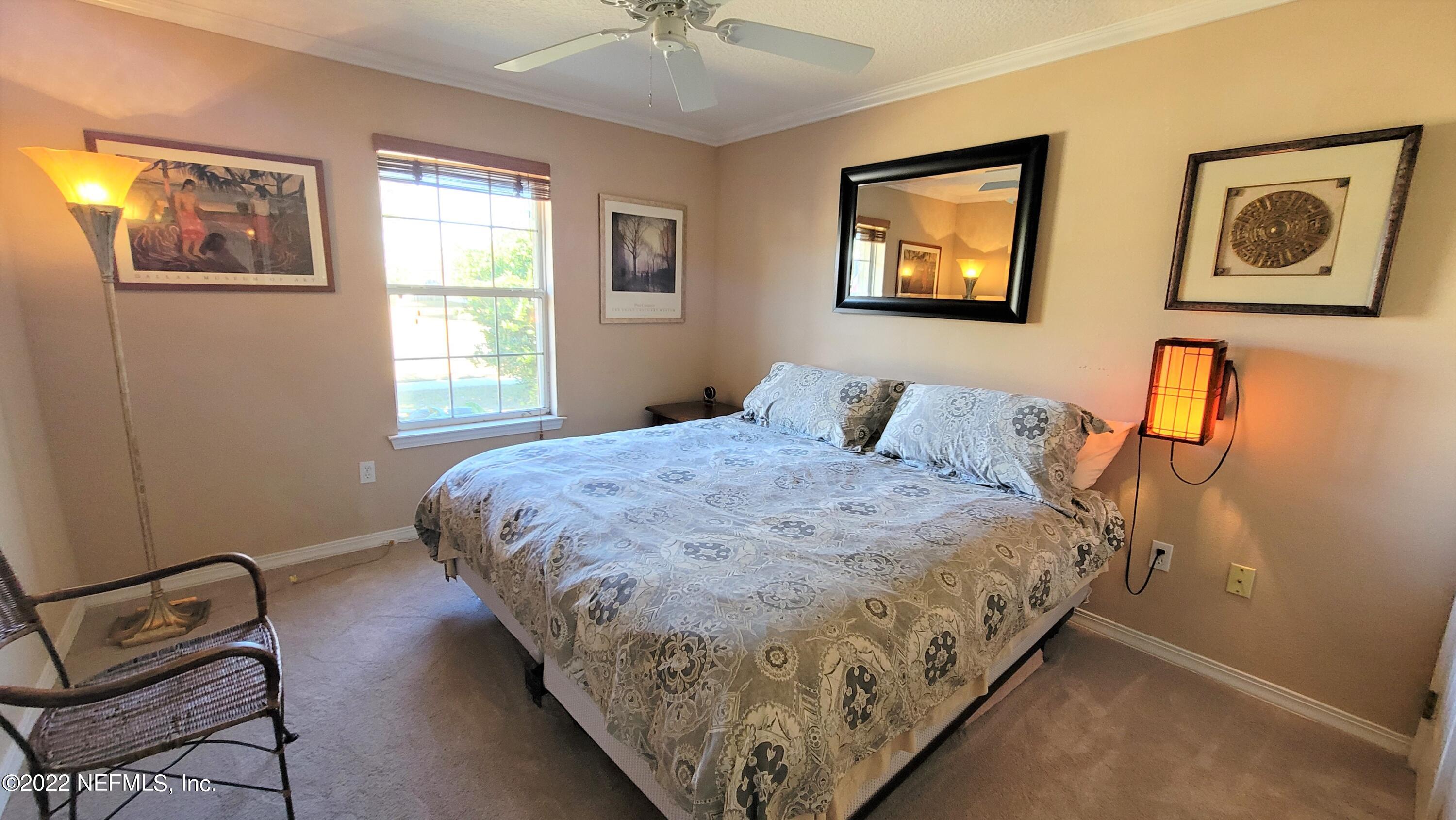 2867 Longleaf Ranch Circle Middleburg, FL 32068 - Photo 23 of 33 a bedroom with bed and window