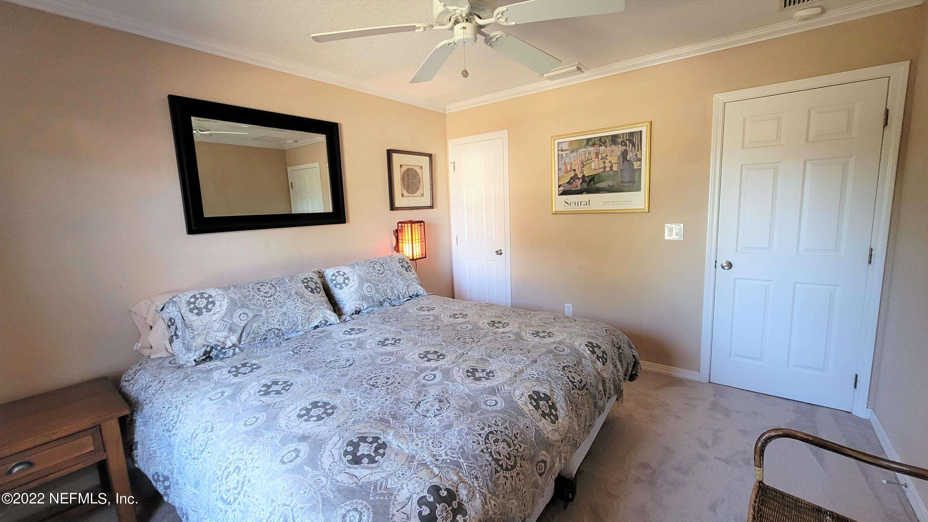 2867 Longleaf Ranch Circle Middleburg, FL 32068 - Photo 25 of 33 a bedroom with a bed and a window