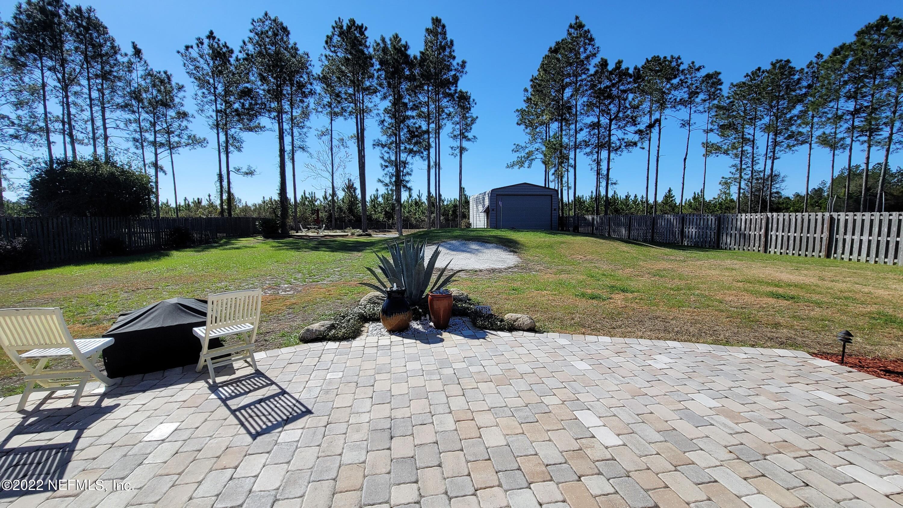 2867 Longleaf Ranch Circle Middleburg, FL 32068 - Photo 28 of 33 a view of backyard with outdoor seating and green space