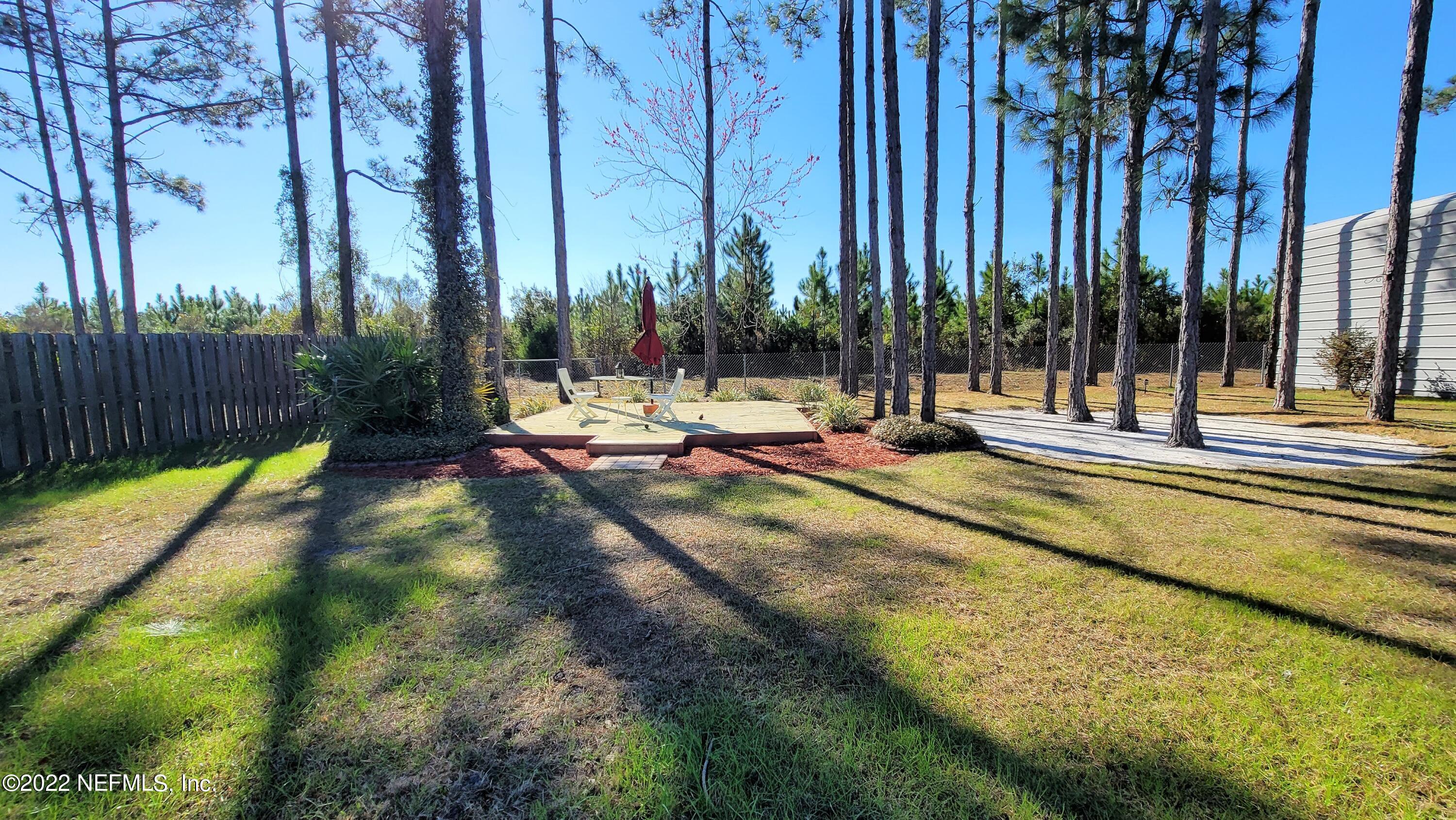 2867 Longleaf Ranch Circle Middleburg, FL 32068 - Photo 29 of 33 a view of a swimming pool with chairs