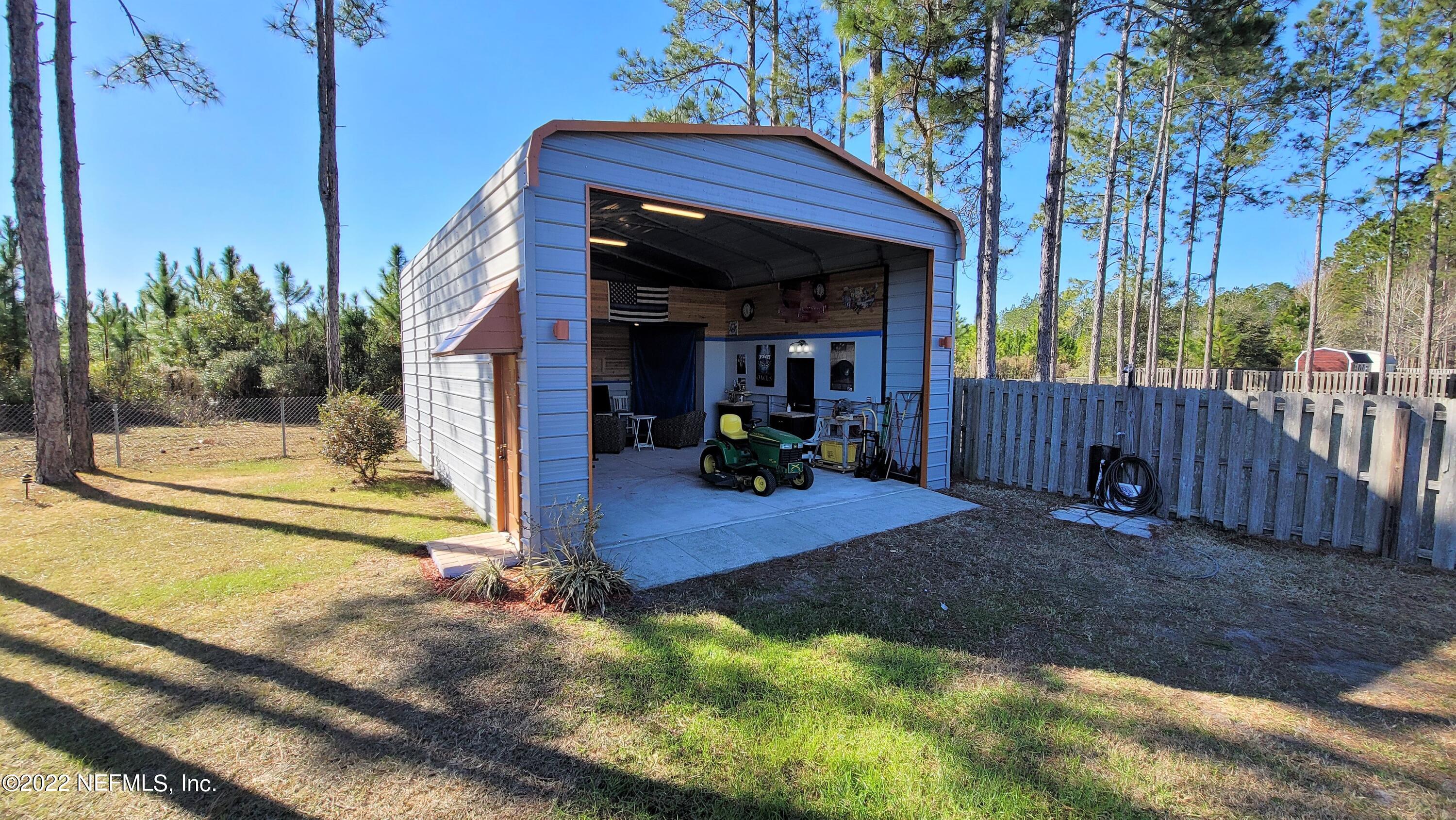 2867 Longleaf Ranch Circle Middleburg, FL 32068 - Photo 30 of 33 a view of a house with backyard and porch