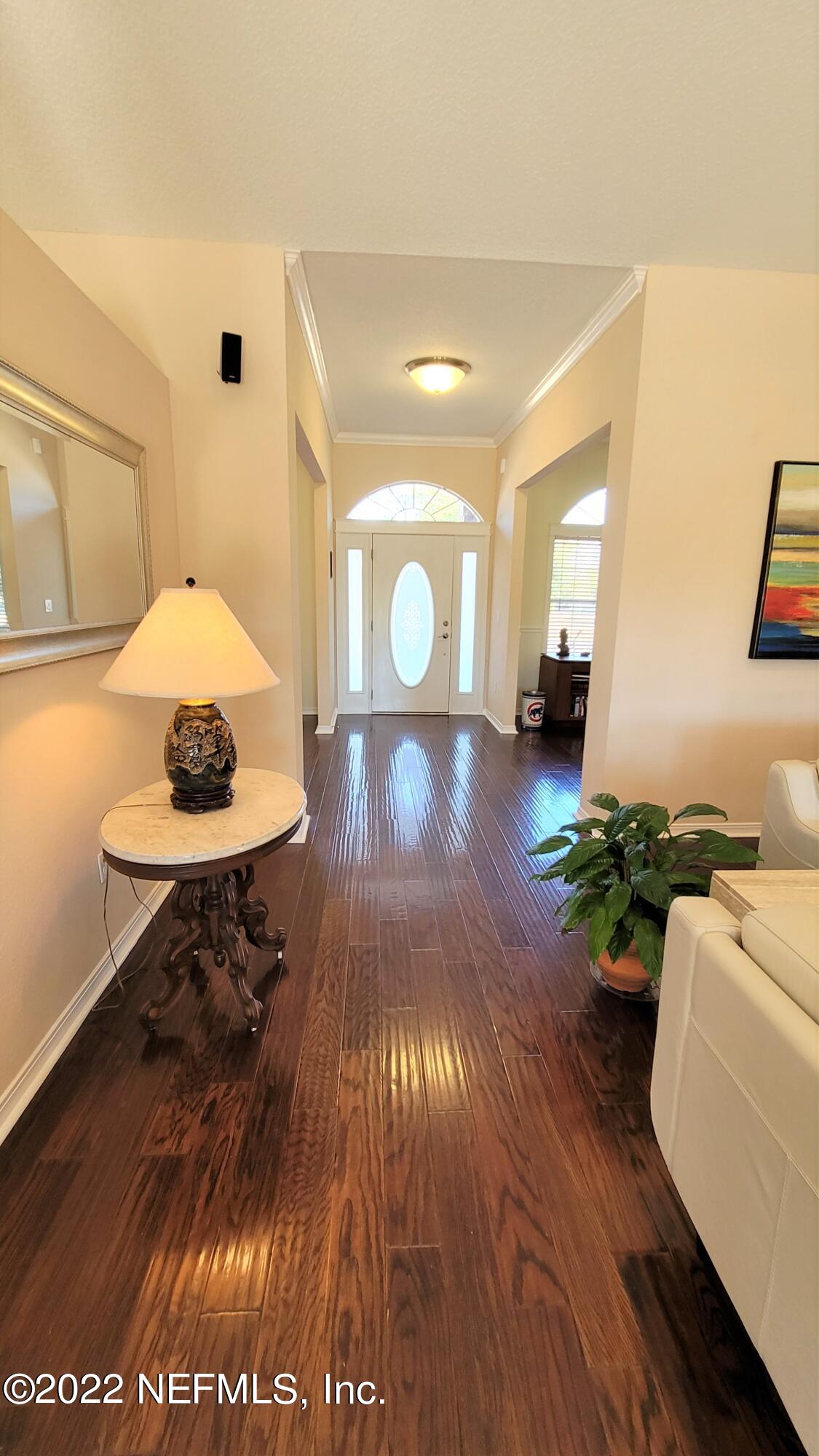 2867 Longleaf Ranch Circle Middleburg, FL 32068 - Photo 3 of 33 a view of a livingroom with furniture wooden floor and a rug