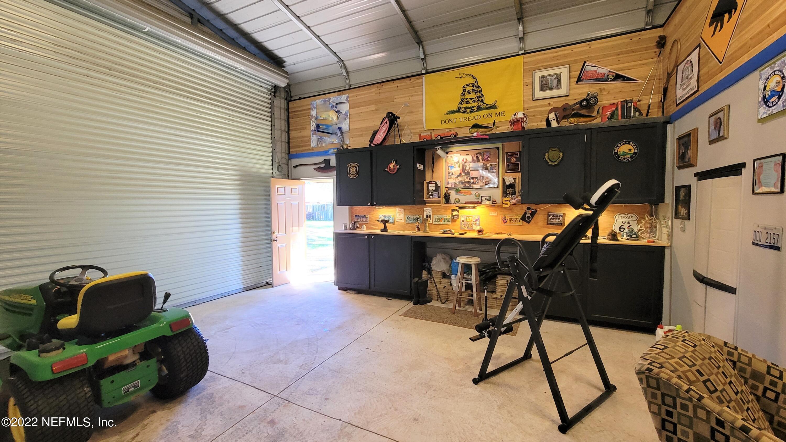 2867 Longleaf Ranch Circle Middleburg, FL 32068 - Photo 31 of 33 a view of a chairs and table in a patio