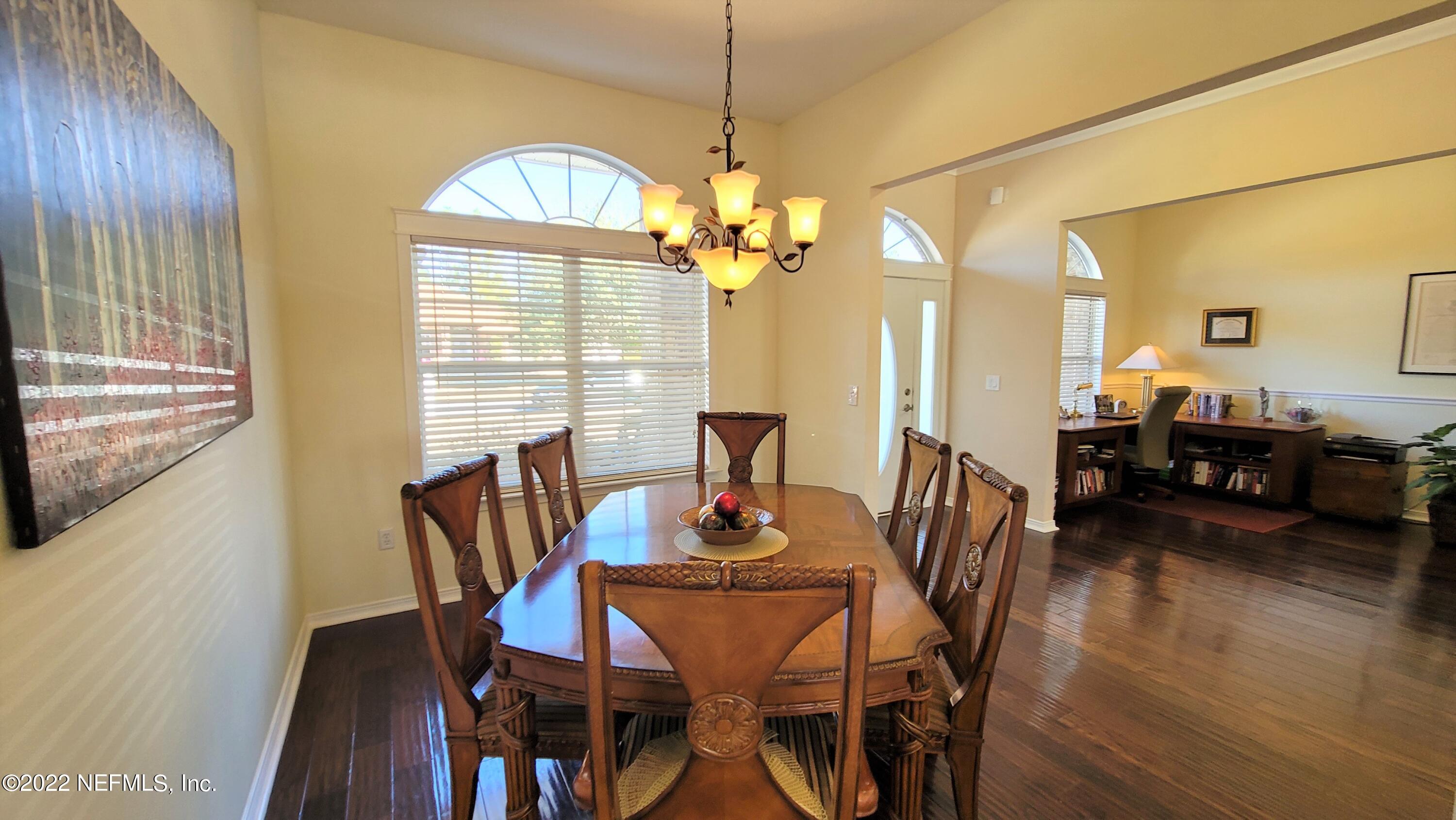 2867 Longleaf Ranch Circle Middleburg, FL 32068 - Photo 4 of 33 a view of a dining room with furniture window and wooden floor