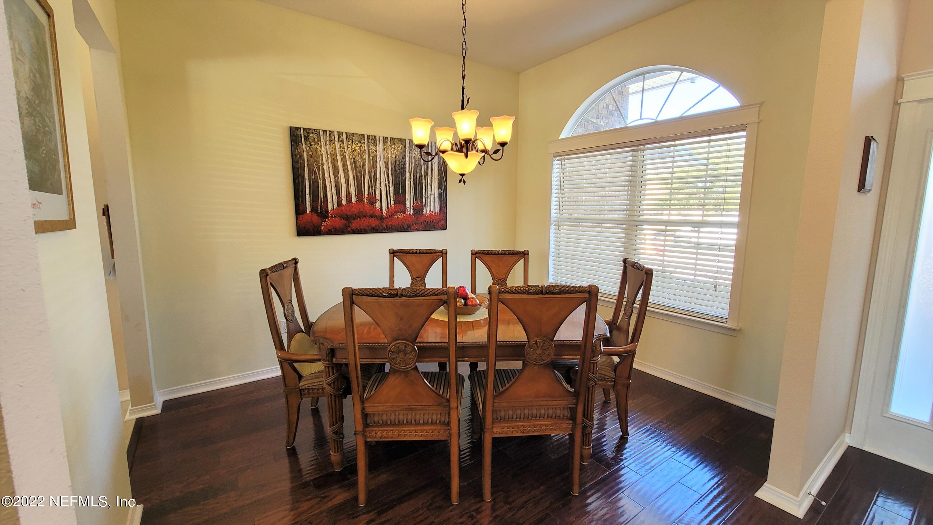 2867 Longleaf Ranch Circle Middleburg, FL 32068 - Photo 5 of 33 a view of a dining room with furniture window and wooden floor
