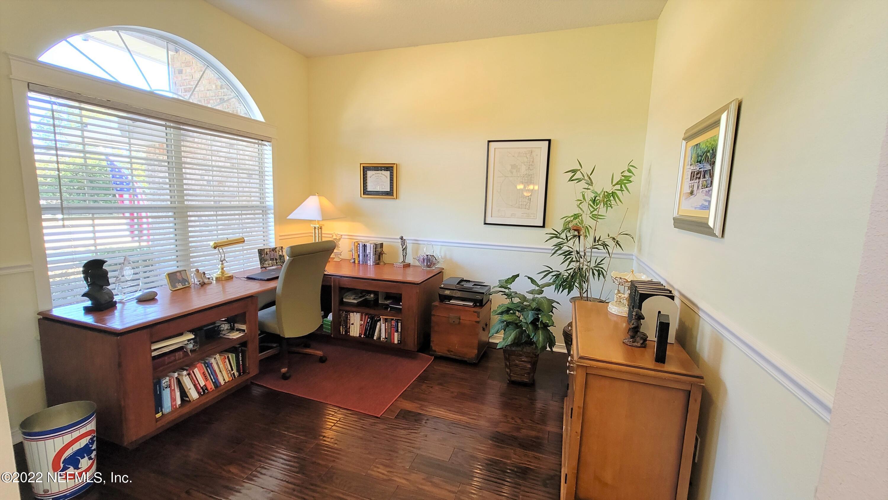 2867 Longleaf Ranch Circle Middleburg, FL 32068 - Photo 6 of 33 a view of a workspace with furniture and a window