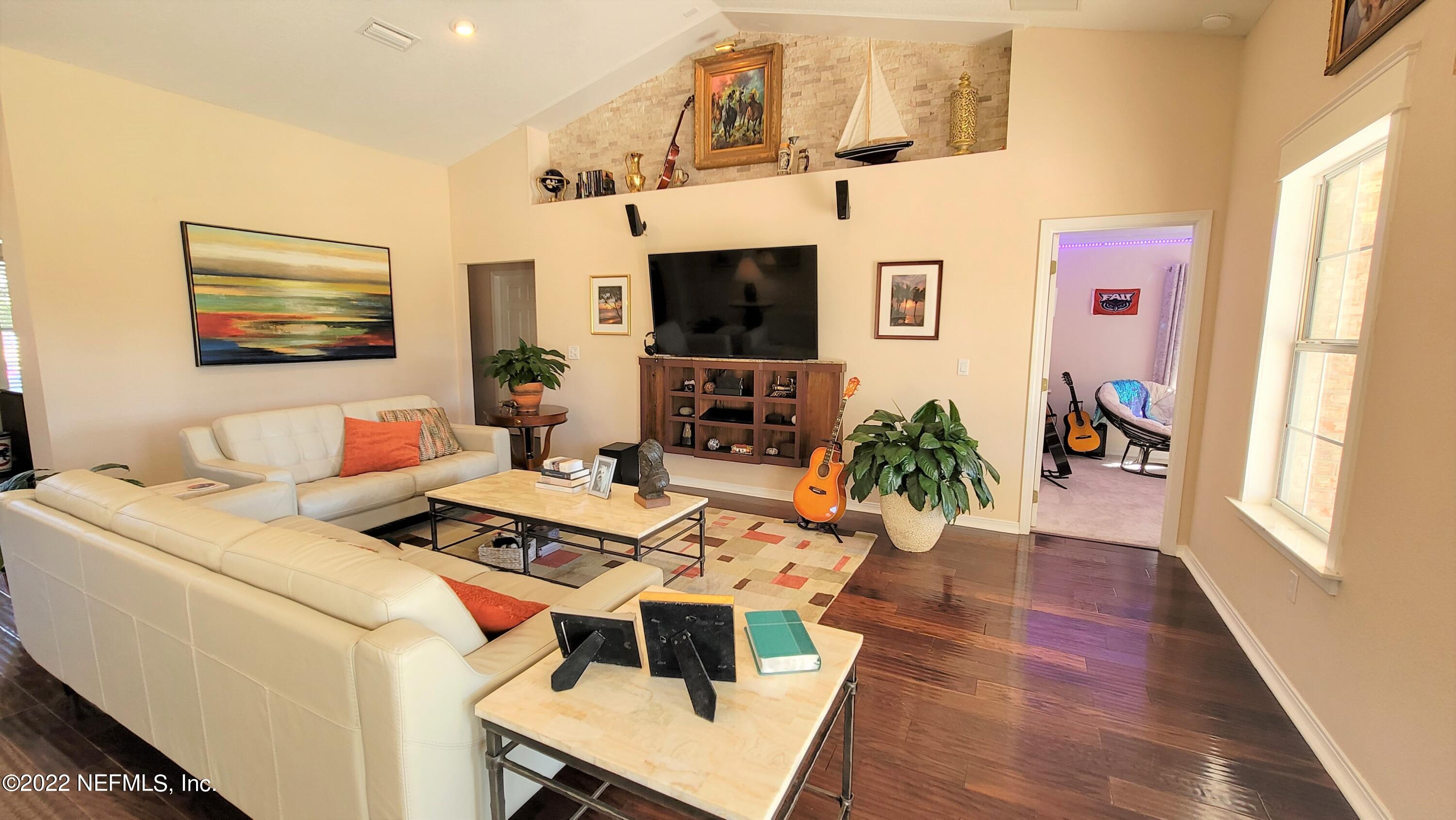 2867 Longleaf Ranch Circle Middleburg, FL 32068 - Photo 8 of 33 a living room with furniture and flat screen tv
