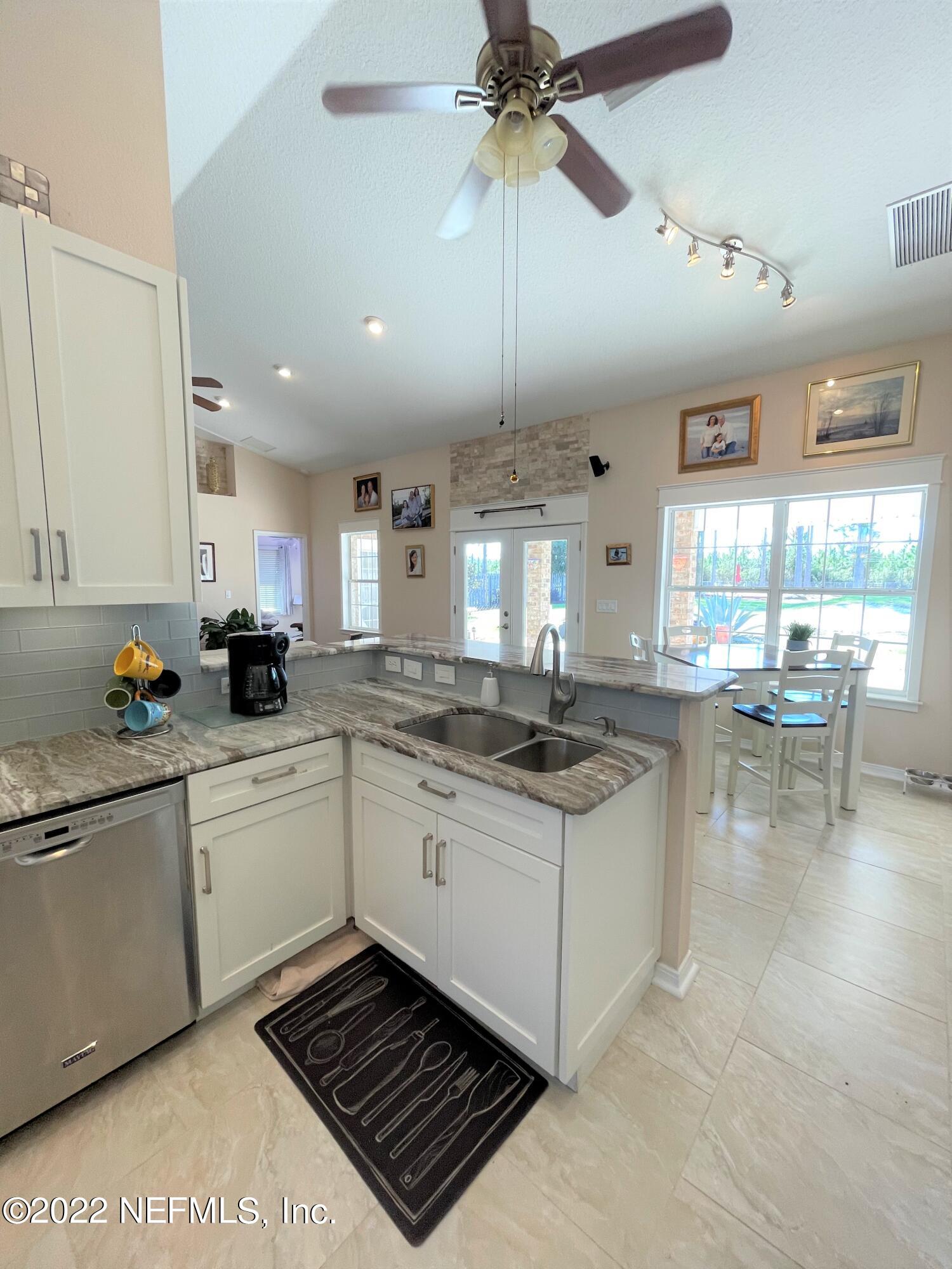 2867 Longleaf Ranch Circle Middleburg, FL 32068 - Photo 10 of 33 a kitchen with a sink and cabinets