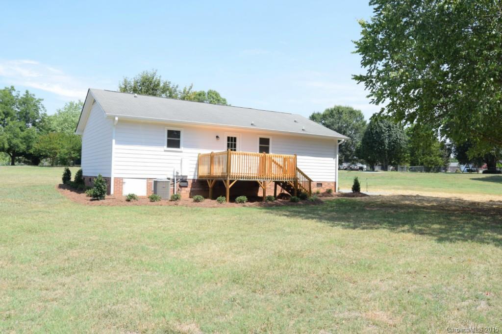 2112 Quail Ridge Road Monroe, NC 28110 - Photo 4 of 14 a view of a house with backyard and trees
