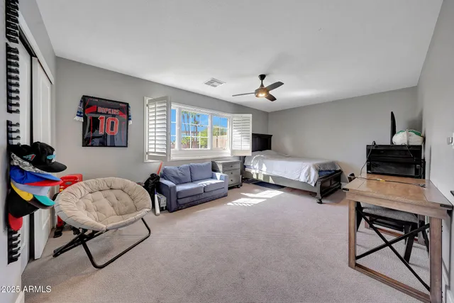 a bedroom with furniture and a chandelier
