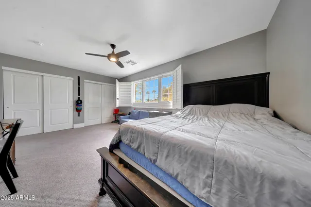 a bedroom with furniture and white walls