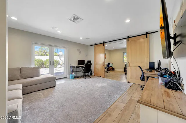 a view of a livingroom with furniture and a flat screen tv