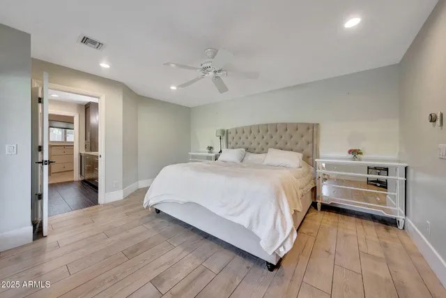 a bedroom with a bed and cabinets