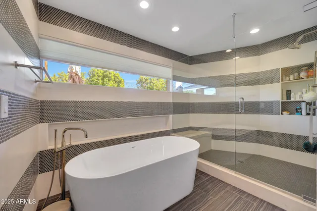 a bathroom with a bathtub and sink