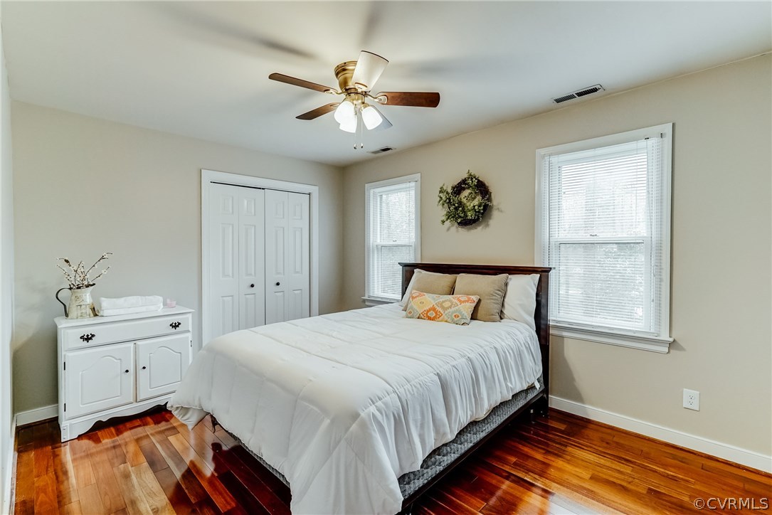 9000 Cardiff Road North Chesterfield, VA 23236 - Photo 27 of 40 a bedroom with a bed and a chandelier