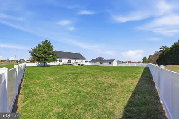 a view of a garden with lawn chairs