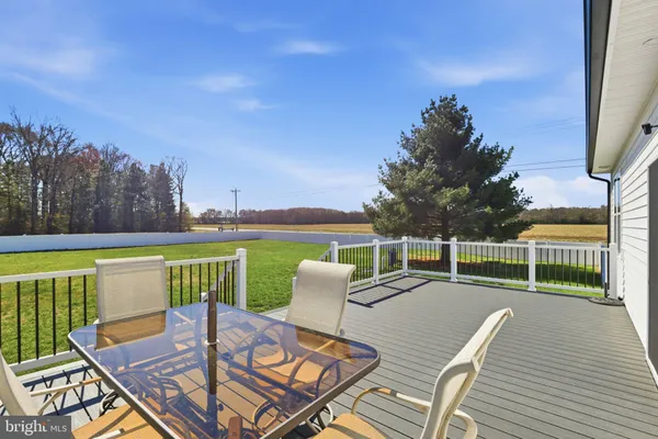 a view of a chairs with a table and chairs in patio