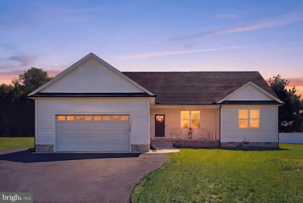 a front view of a house with yard