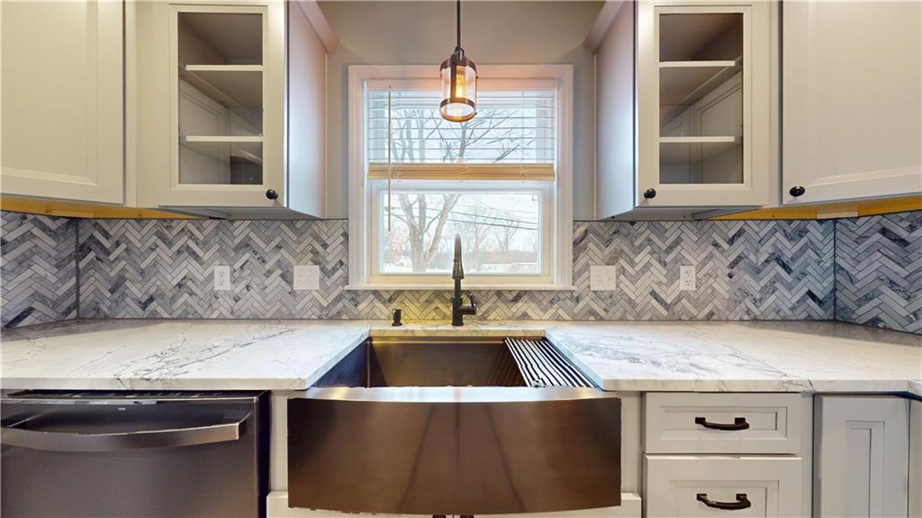 820 Sunset Drive Butler, PA 16001 - Photo 12 of 34 a kitchen with a stove and a sink