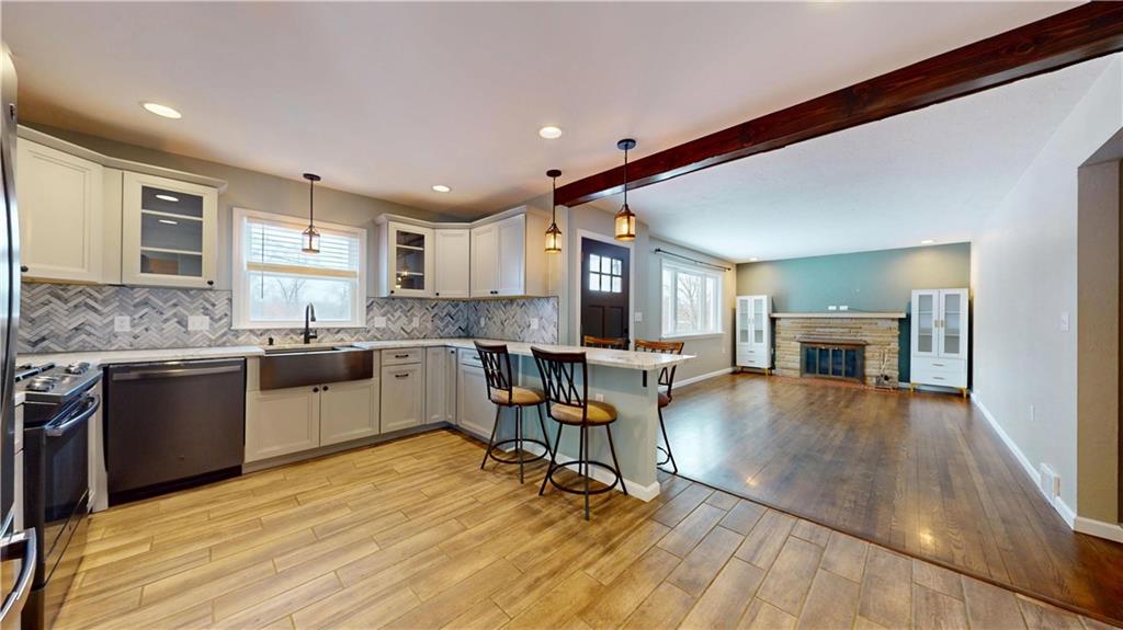 820 Sunset Drive Butler, PA 16001 - Photo 16 of 34 a open kitchen with granite countertop a sink cabinets and wooden floor
