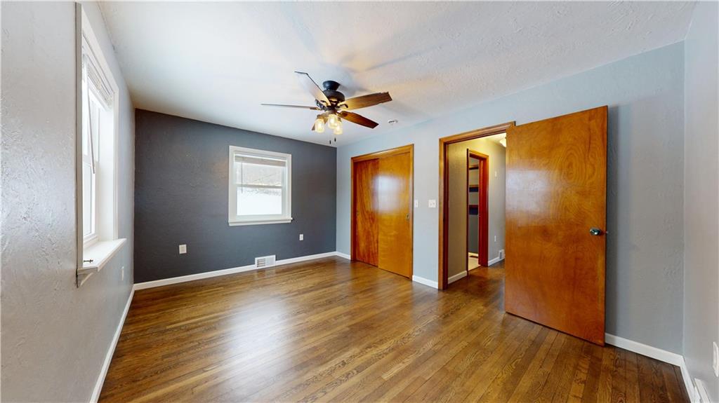 820 Sunset Drive Butler, PA 16001 - Photo 18 of 34 a view of an empty room with window and wooden floor