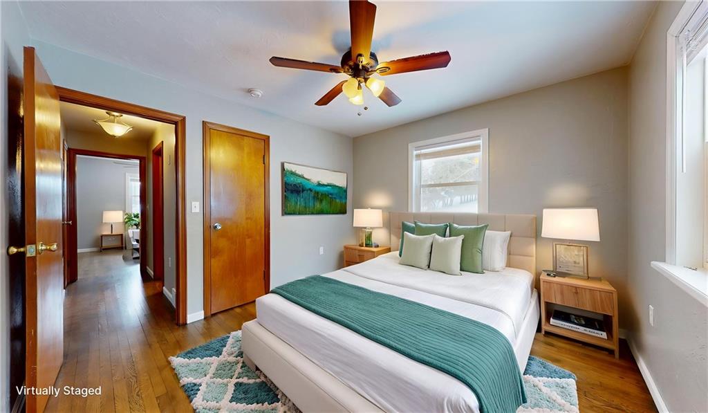 820 Sunset Drive Butler, PA 16001 - Photo 19 of 34 a bedroom with a bed and a chandelier