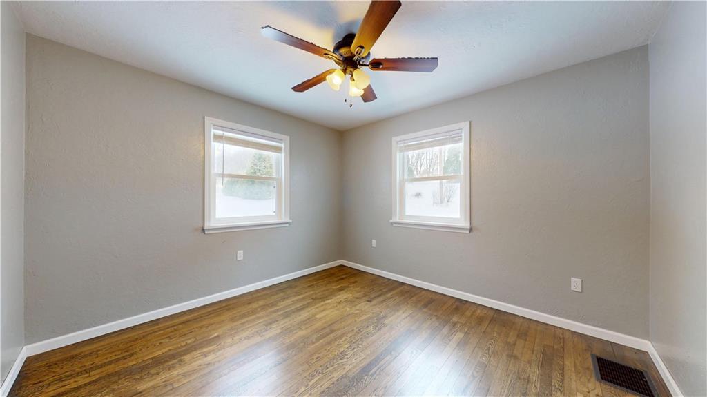 820 Sunset Drive Butler, PA 16001 - Photo 23 of 34 a view of empty room with wooden floor and fan