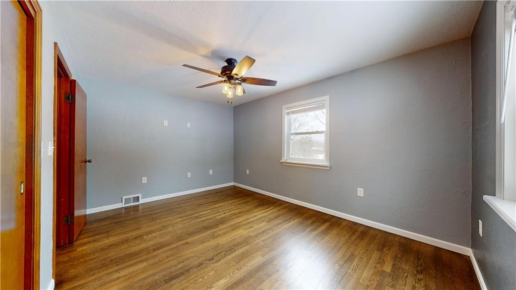 820 Sunset Drive Butler, PA 16001 - Photo 25 of 34 a view of a room with wooden floor and a ceiling fan