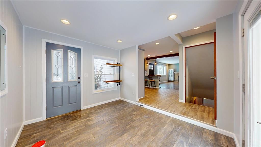 820 Sunset Drive Butler, PA 16001 - Photo 28 of 34 a view of a hallway with wooden floor and kitchen space