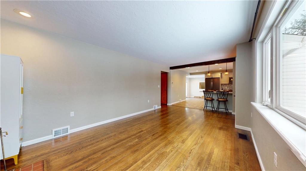 820 Sunset Drive Butler, PA 16001 - Photo 5 of 34 a view of empty room with wooden floor and fan