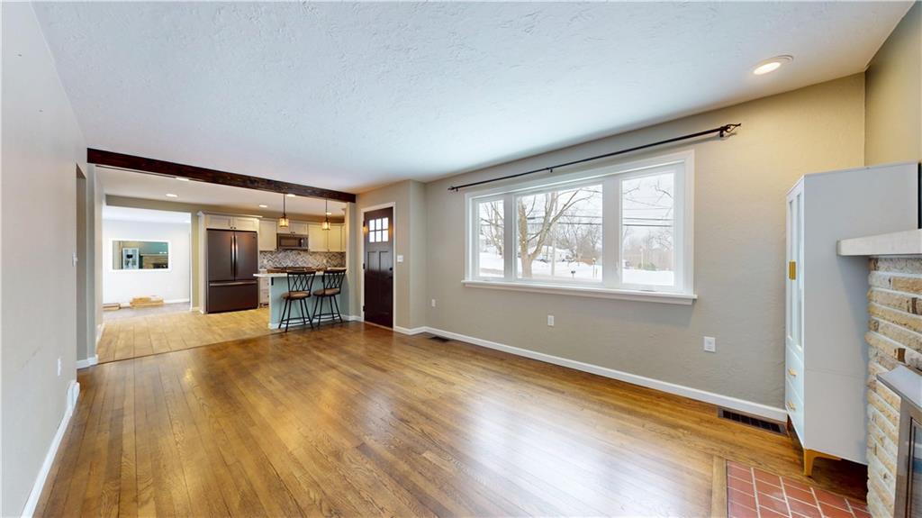 820 Sunset Drive Butler, PA 16001 - Photo 6 of 34 a view of an empty room with window and wooden floor