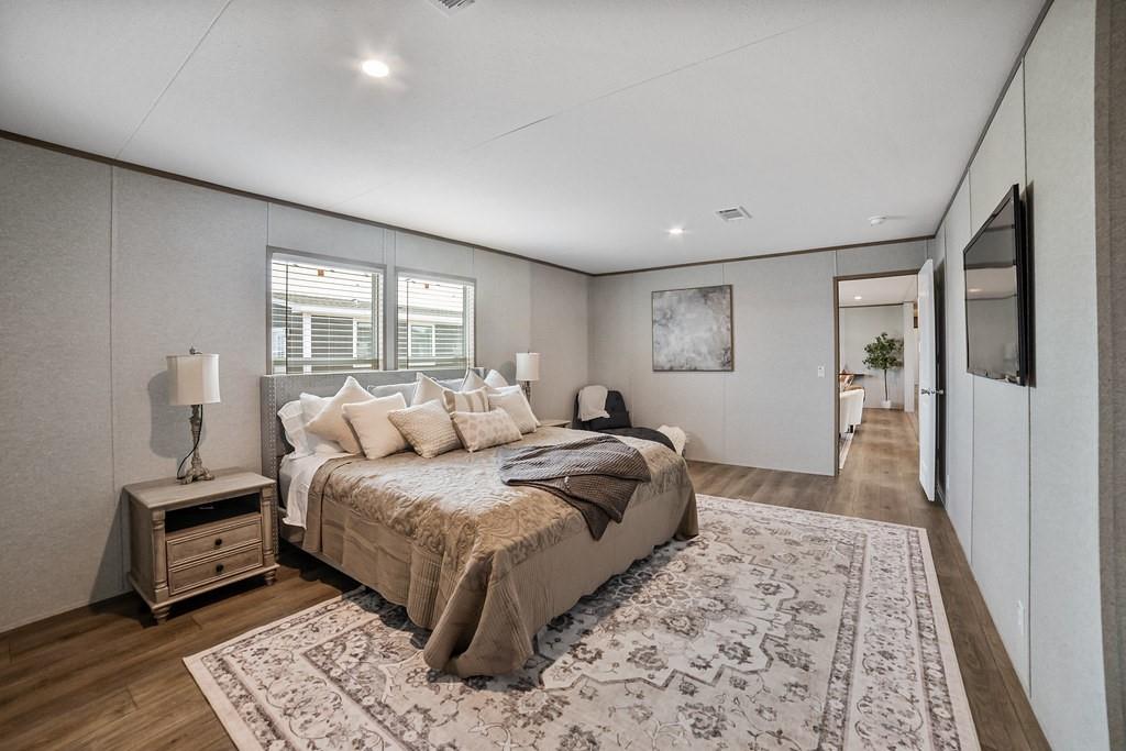 3106 Smyrna Road Sunset, TX 76270 - Photo 13 of 38 a bedroom with a large bed and a rug