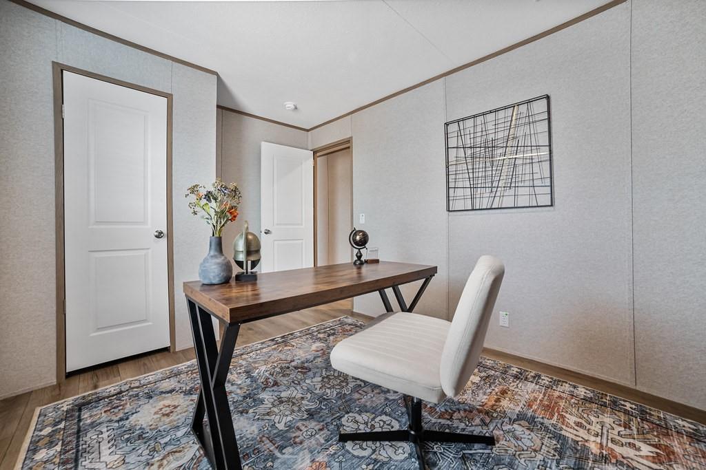 3106 Smyrna Road Sunset, TX 76270 - Photo 28 of 38 a view of a workspace with furniture and wooden floor