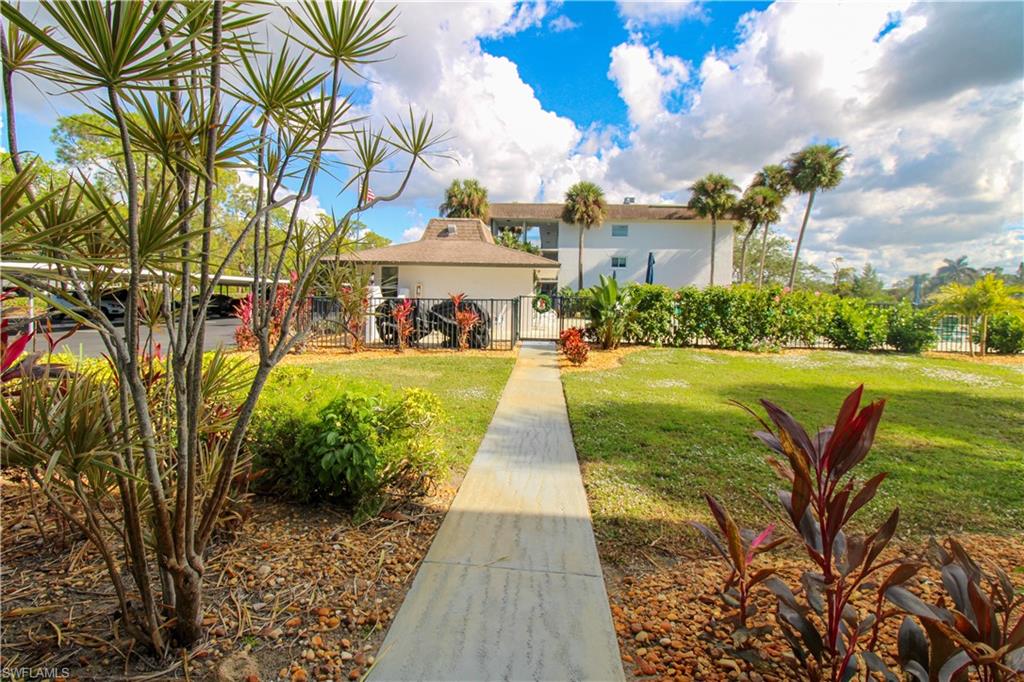 5635 Rattlesnake Hammock Road, Unit 102D Naples, FL 34113 - Photo 11 of 47 a view of a yard with plants