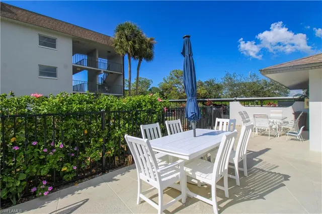 a view of a chairs and table in a patio
