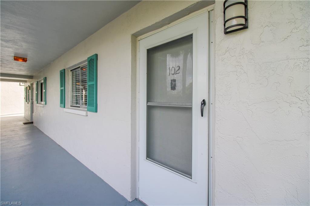 5635 Rattlesnake Hammock Road, Unit 102D Naples, FL 34113 - Photo 17 of 47 a view of an entryway with wooden floor