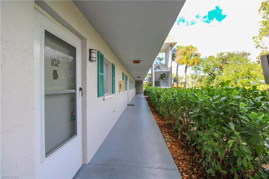 5635 Rattlesnake Hammock Road, Unit 102D Naples, FL 34113 - Photo 18 of 47 a view of a house with balcony