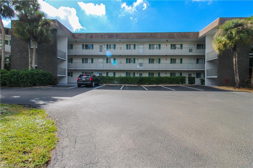 5635 Rattlesnake Hammock Road, Unit 102D Naples, FL 34113 - Photo 2 of 47 a view of a building with a street view